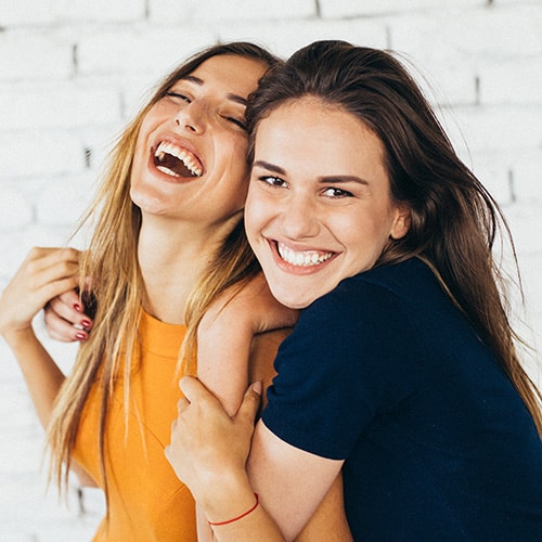 Friends smiling at Smile Arc Orthodontics in San Diego, CA