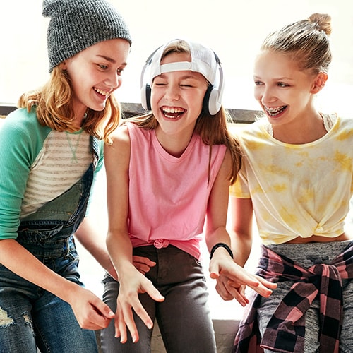 Friends laughing at Smile Arc Orthodontics in San Diego, CA